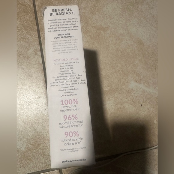 Open box. PMD Pink and White Skincare Device with Accessories - Picture 5 of 6